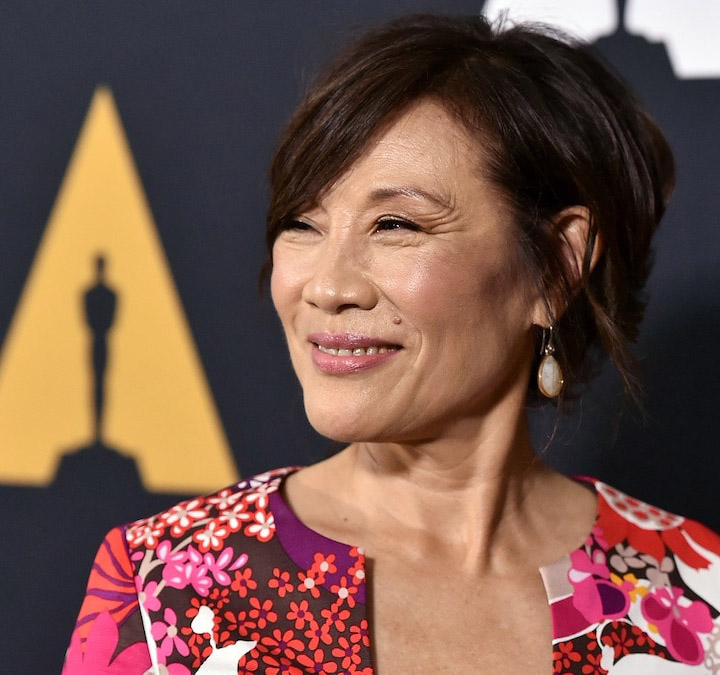 Janet Yang in front of Academy step and repeat